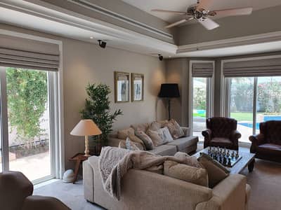 4 Bedroom Villa for Sale in Green Community, Dubai - Sitting area with view on Pool 4 Bedroom Villa for Sale in Green Community, Dubai - Sitting area with view on Pool