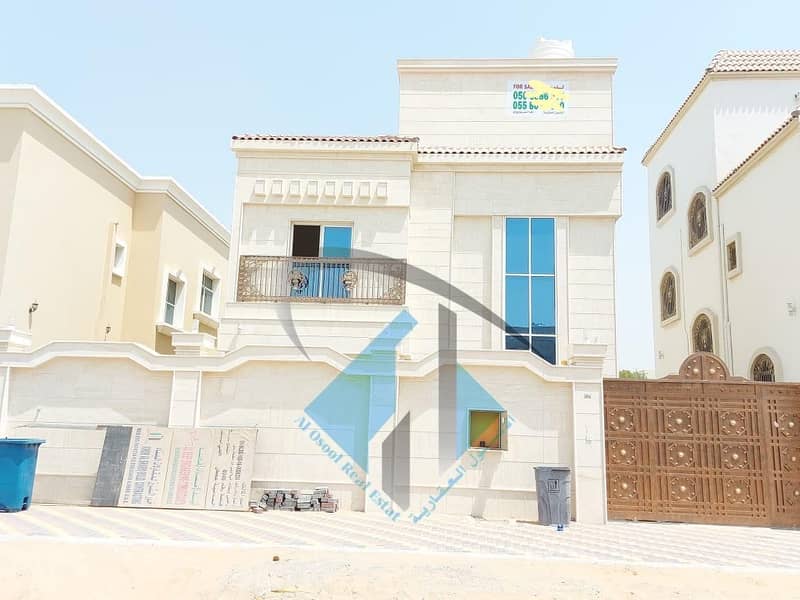 For sale a villa in Ajman facing a stone on a running street without initial payment and in monthly installments for a period of 25 years with a large bank indulgence