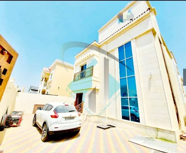 For sale a villa in Ajman facing a stone on a running street without initial payment and in monthly installments for a period of 25 years with a large