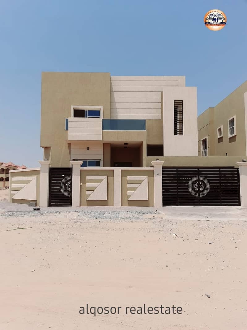 Villa for sale in Ajman, Al Mowaihat area, two floors, excellent location, super deluxe finishing, two street corner, with the possibility of bank financing