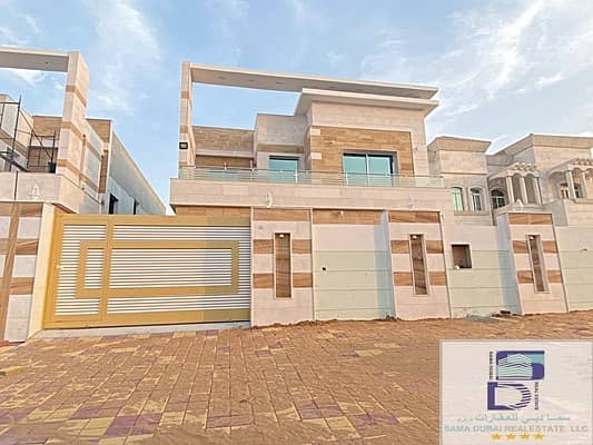 Villa for sale in Ajman, the Rawda area, with a two-story stone face, excellent location, super deluxe finishing, with the possibility of bank financing