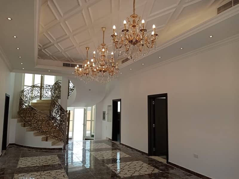 luxury villa for rent in el khawaneej(5 bed room + 2hall + majls + maid room + garden + parking )