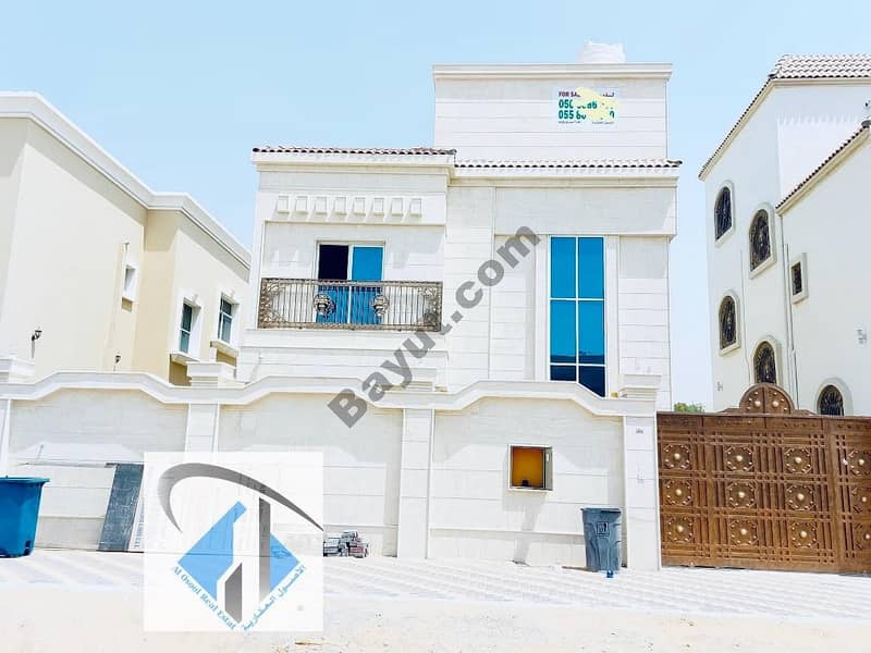 For sale, a villa in Ajman, facing a stone, on a neighboring street, a wonderful finishing without a down payment and on monthly installments for a period of 25 years with a large bank indulgence