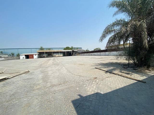 42000 SQFT LAND FULLY INTERLOCKED WITH FENCING ,OFFICES,TOILETS AND HEAVY POWER 160KW FOR RENT AED 600K.