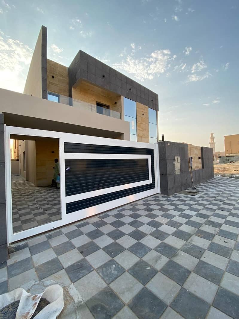 Villa for sale in Ajman, Rawda area, stone face, super deluxe finishing, with the possibility of bank financing