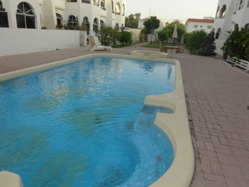 Spacious 5 bedroom plus maid compound villa with shared pool in Umm Suqeim 2