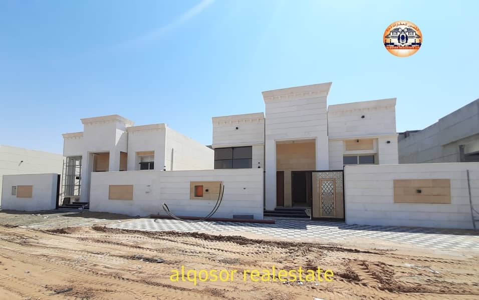 Villa for sale in Ajman, Al Amerah area, ground floor, facing stone, near Emirates Road, with the possibility of bank financing