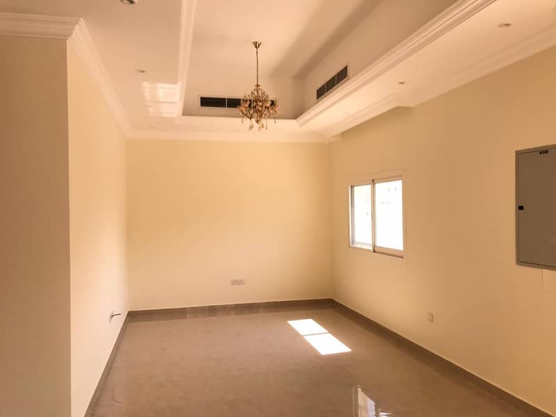 New villa for rent in Al Khawaneej (4 master bedrooms + hall + maid room + kitchen + laundry room + dining room + driver's room + planted garden + covered parking)
