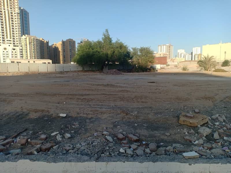 Lands for sale in Ajman - residential and commercial -FREEHOLD- on Sheikh Khalifa bin Zayed St. - Gulfa Bridge - near Dana Mall-for investment- ground +18