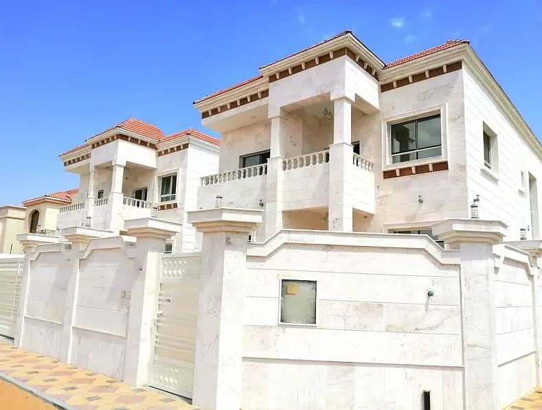 For urgent sale, a very luxurious villa with a stone face with a wonderful and unique design and a suitable area in Al Mowaihat behind the new Nesto Mall close to the mosque and all services at a very attractive price with the arrangement of bank financin