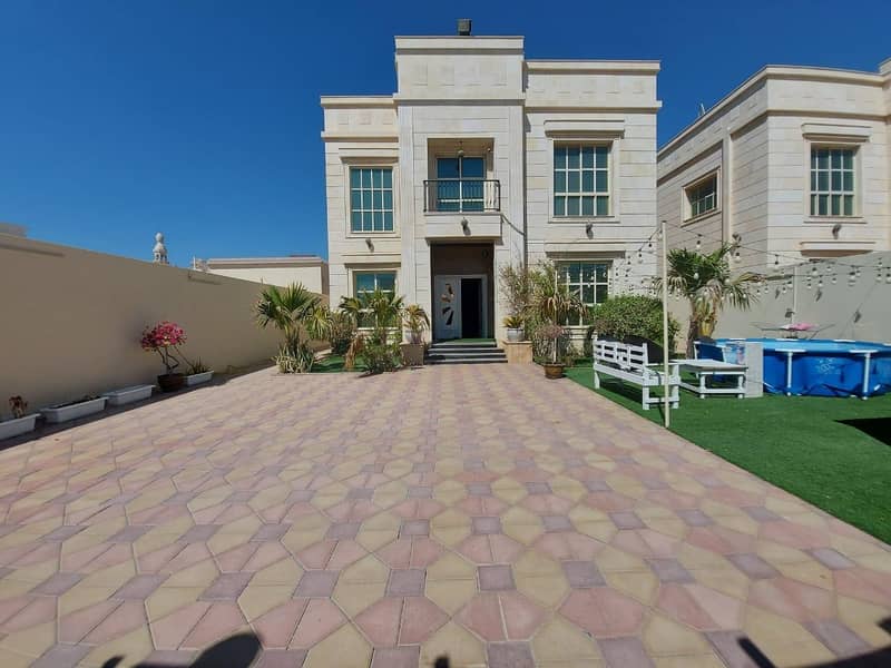 For sale a villa in Ajman connected to electricity and water, with a stone face for the entire villa, a very excellent location without down payment and on monthly installments for a period of 25 years with a large bank leniency