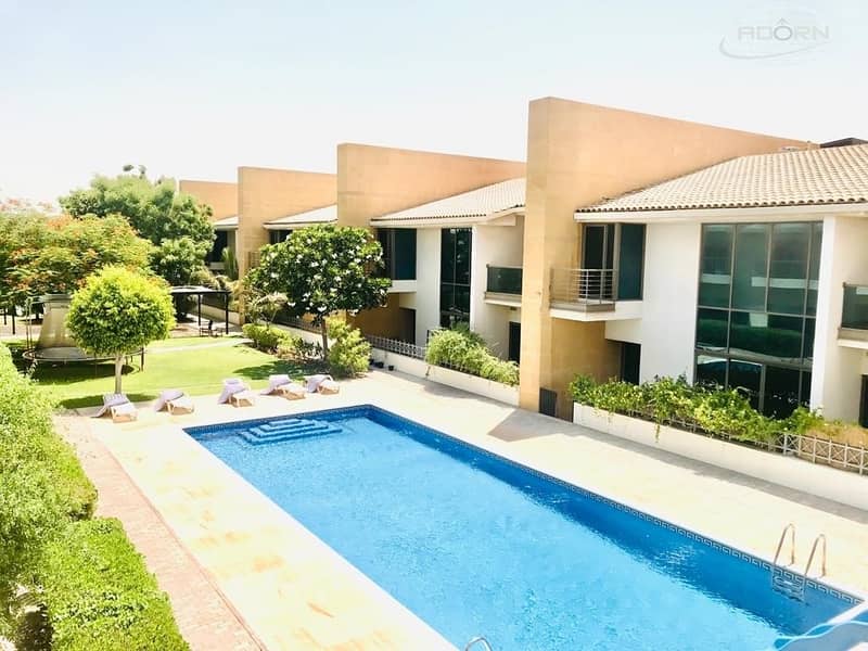 Excellent 5 bedroom plus maid compound villa with shared pool and pvt garden in Umm Suqeim 3