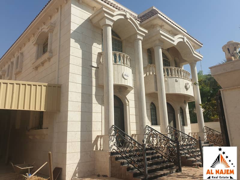 Sale is a stone villa with electricity, water, split air conditioners, furniture and a swimming pool in the Rawda area in Ajman with the possibility of bank or cash financing