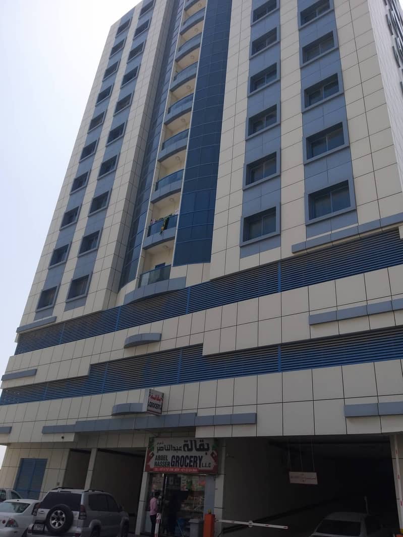 For rent in Ajman, Al Nuaimia area 1 behind Thumbay Hospital, a very clean tower, a room, a hall, and 2 bathrooms with a balcony, large areas and central air conditioning