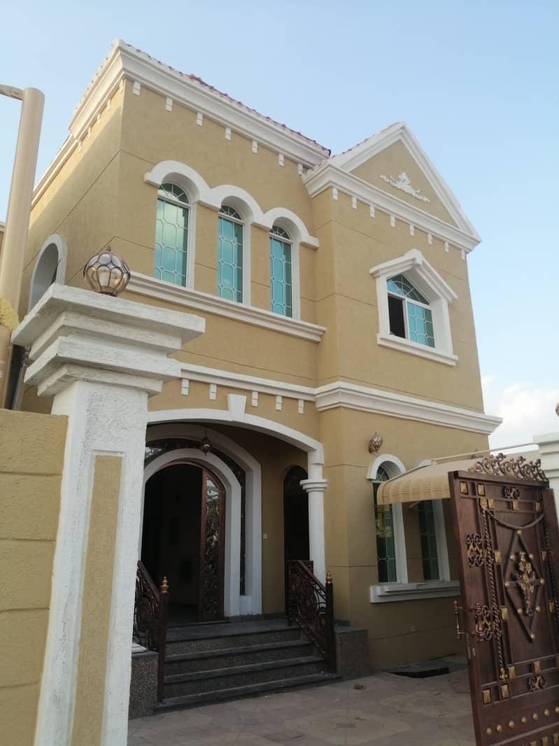 Villa for sale, personal finishing, excellent price, Ajman, close to the main street, a large building area