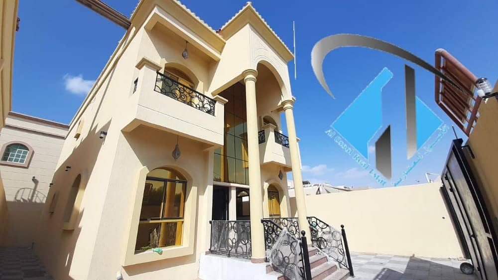 Villa for sale in Ajman, Al Mowaihat area, second piece of asphalt street, with a different design floor next to all services with the possibility of bank financing