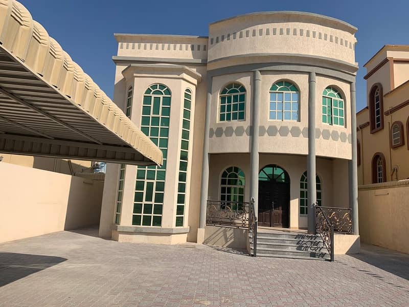 For rent a two-storey villa consisting of 5 bedrooms, a majlis and a hall with air conditioners, in Al Rawda, Ajman