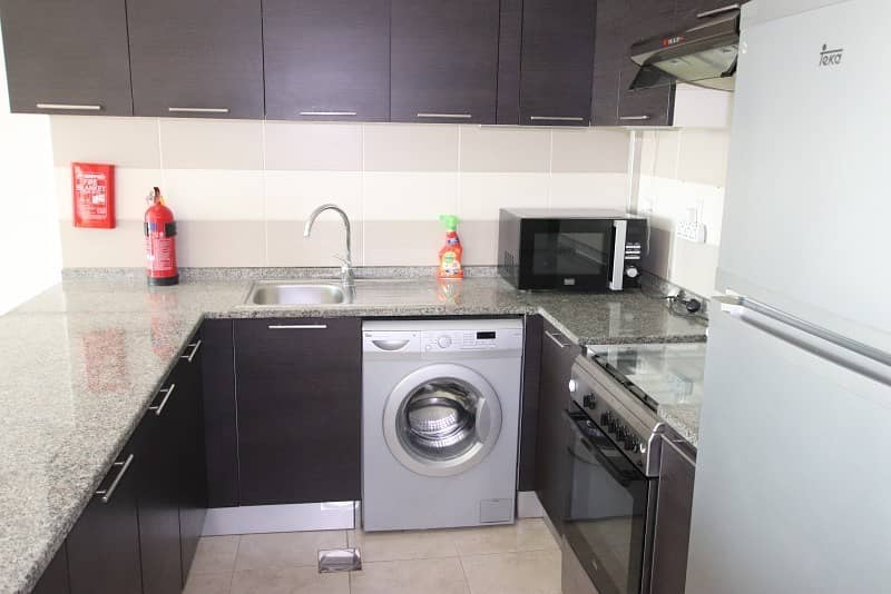6 Fully Equipped Kitchen |Pool View | Middle Unit |1BR+Blcny